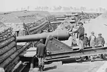 Ft Brady Va-Company C 1st CT heavy Artillery. Gun crew wearing the late-war sack coat. The officer's private purchase blue wool jacket is based on a typical civilian style. The soldier with his back to the camera has a pair of riding boots and several of the men wear civilian hats