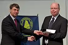 Andrew Fazakerley receiving the medal in 2012