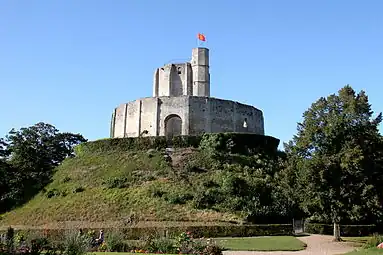 The polygonal donjon at Gisors, France, on a motte with an encircling wall.