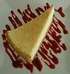 Cheesecake with a dessert sauce on the plate