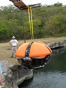 Deep Phreatic Thermal Explorer (DEPTHX) robot being lowered into La Pilita, one of several sinkholes in Sistema Zacaton (2007)