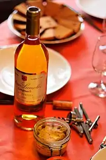 A terrine of foie gras with a bottle of Sauternes