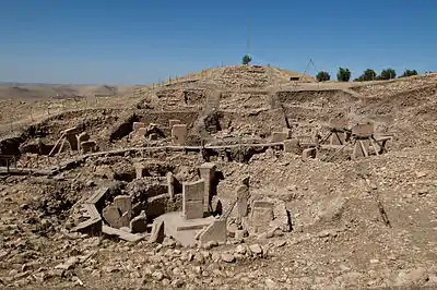 Photograph of the main excavation area of Göbekli Tepe, showing the ruins of several prehistoric structures.