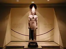 Amenhotep III standing upon Sled of God Tem (oldest creator god Atum)