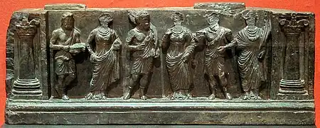 Greco-Buddhist frieze of Gandhara with devotees, holding plantain leaves, in Hellenistic style, inside Corinthian columns, 1st–2nd century CE. Buner, Swat, Pakistan. Victoria and Albert Museum.