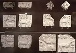 Seals with Indus script and impressions; 2500-2000 BC; steatite; various sizes, mostly c.3 cm; British Museum (London)