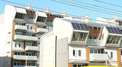 K2 Apartments. Windsor, Victoria.  Completed 2006.  Highly visible solar panels, prominent natural ventilators and use of natural materials.