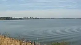 A view of the calm Lake Tobesofkee in the wintertime. Taken facing Northwest from beside the Lower Thomaston Road Bridge.