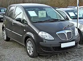 Five-door car with alloy wheels, door mirrors, flush headlights, and black-plastic trim on the front bumper