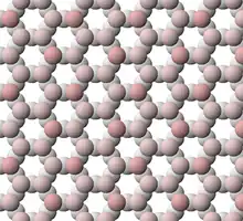 View of tetrahedral sheet structure of mica. The apical oxygen ions are tinted pink.