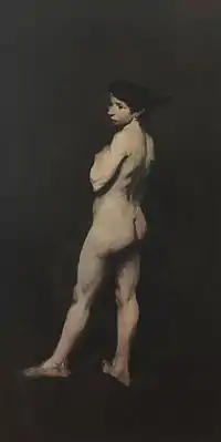 a nude white woman, against a black background