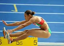 Image 32Naide Gomes in the jumping phase of the event (from Track and field)