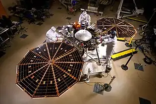 Image 21The InSight lander with solar panels deployed in a cleanroom (from Engineering)