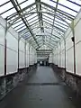 Covered walkway leading from the main station entrance on Princes Street to the concourse and ticket office