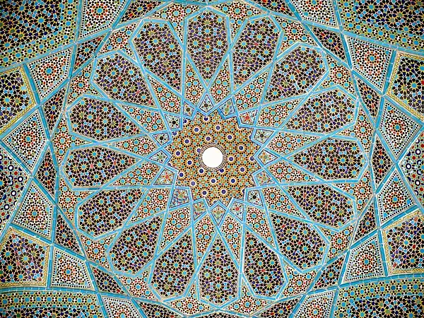 Complex girih patterns with 16-, 10- and 8-point stars at different scales in ceiling of the Tomb of Hafez in Shiraz, 1935