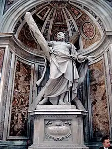  This statue shows an elderly man, bare-chested, and draped, looking up despairingly as he supports a large cross, arranged diagonally.