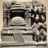 A model resembling the Saidu Sharif Stupa, with square base and four columns (1st century CE).