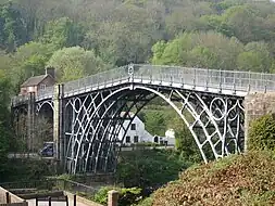 Image 5The application of the steam engine allowed coke to be substituted for charcoal in iron making, lowering the cost of iron, which provided engineers with a new material for building bridges. This bridge was made of cast iron, which was soon displaced by less brittle wrought iron as a structural material. (from Engineering)