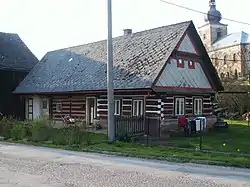 Log house and Church of the Annunciation