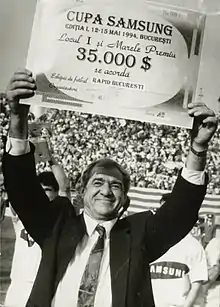 Viorel Hizo, holding up a prize check in 1994