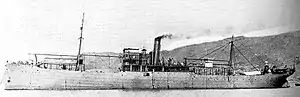 Warship on the sea with mountainous background