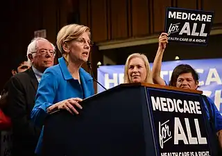 Image 18Elizabeth Warren and Bernie Sanders campaigning for extended US medicare coverage in 2017.  (from Health politics)